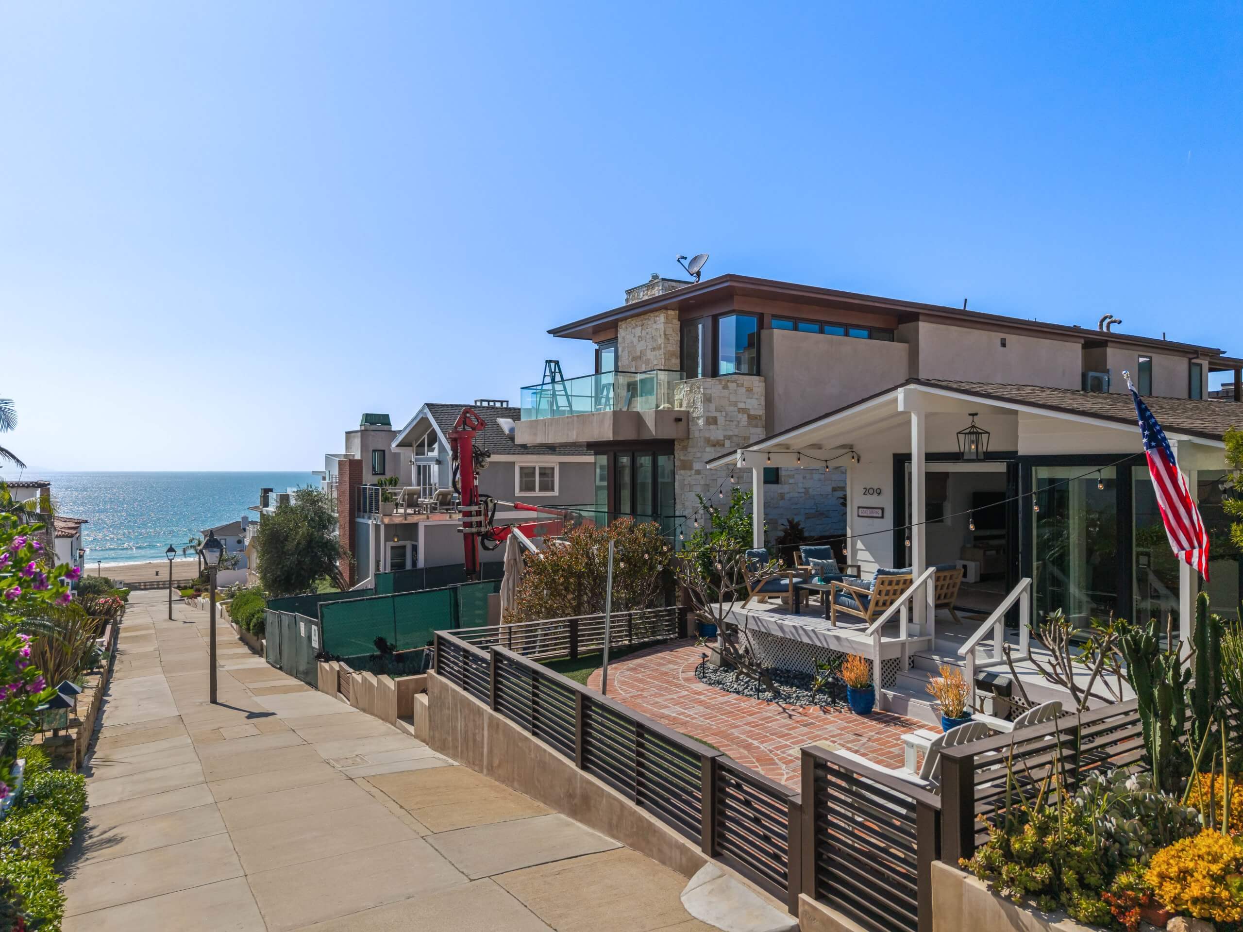 Enjoy ocean views just steps away, with a front patio designed for relaxed outdoor living and easy access to the beach.